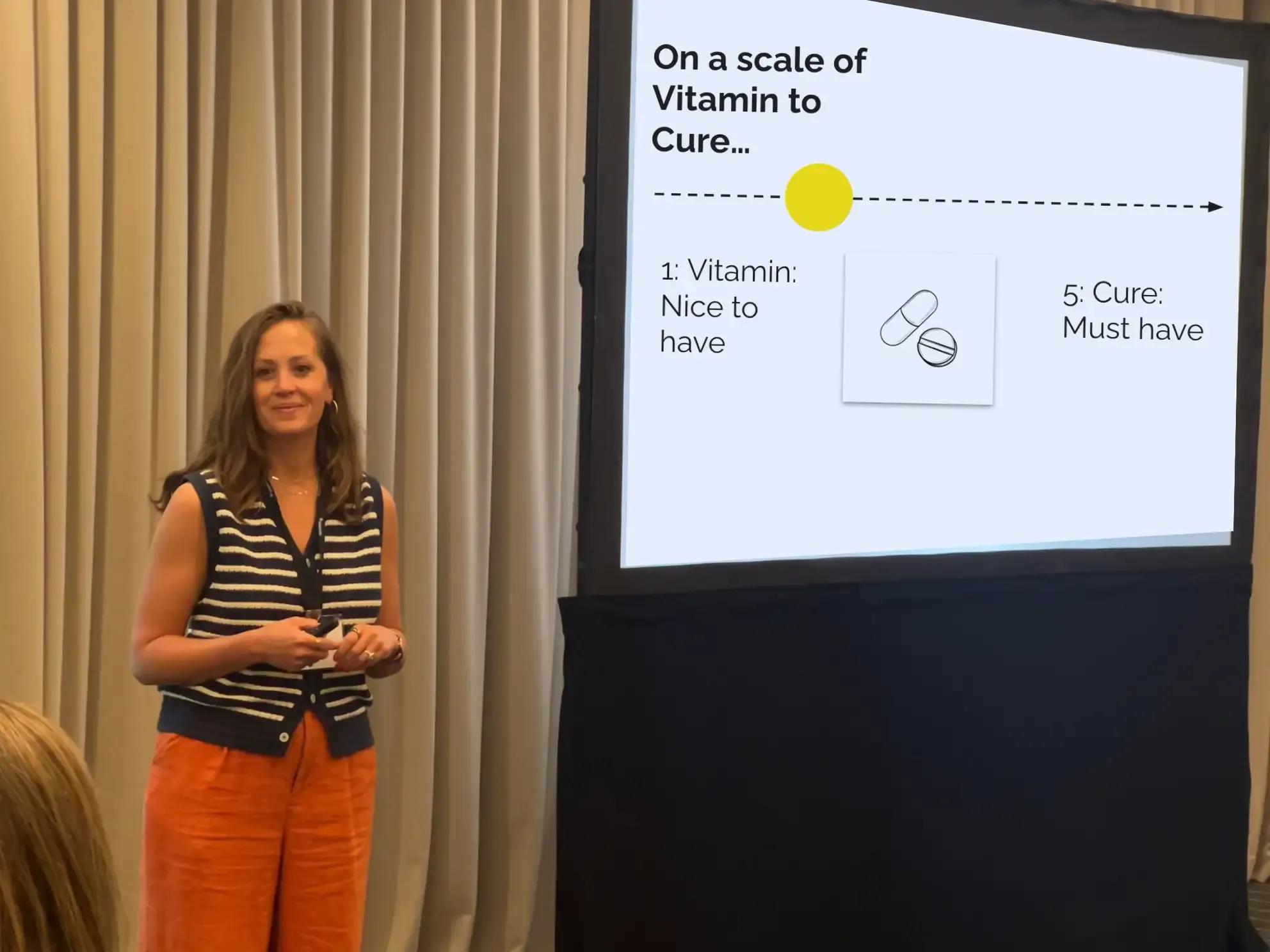 Image of Sara Lockna and Erin Murphy speaking at presentation in front of whiteboard