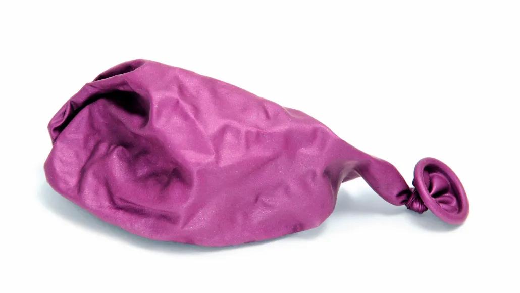 An illustration shows a deflated balloon lying flat.