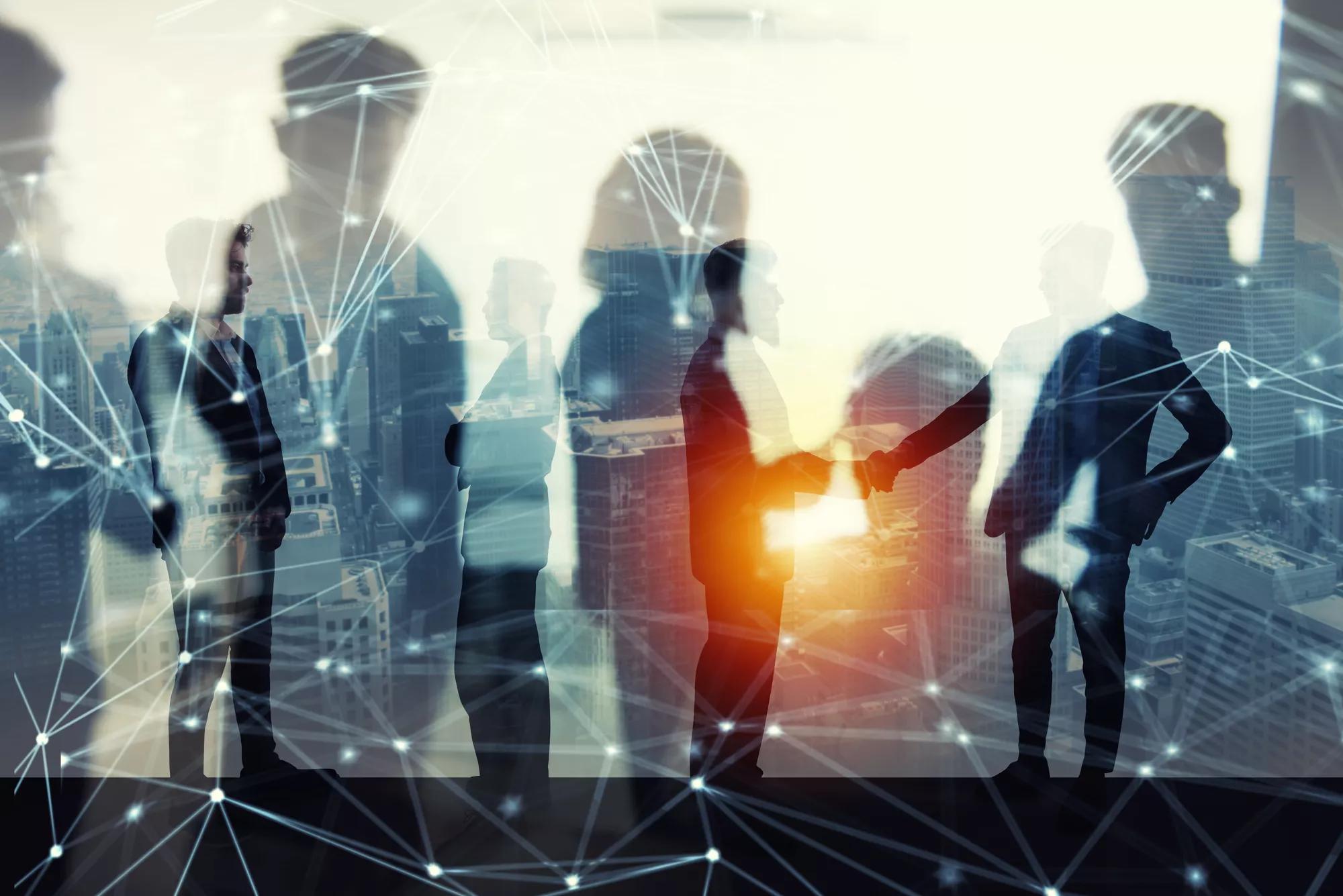 Handshaking business person in office with network effect. concept of teamwork and partnership. double exposure