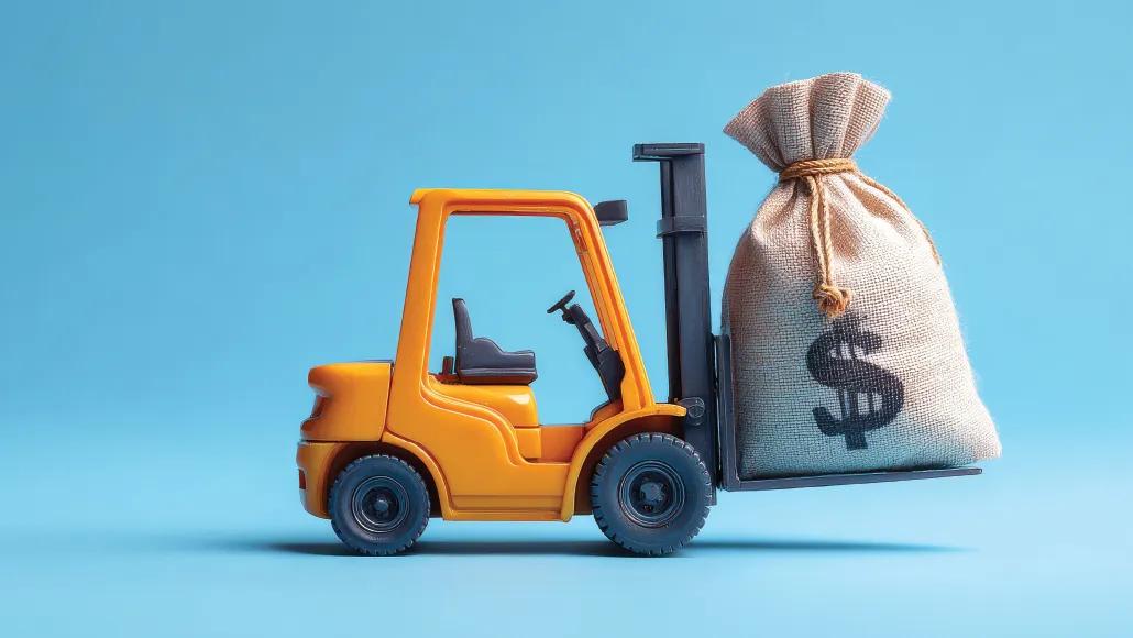 An illustration shows a toy truck lift carrying a large sack of money.