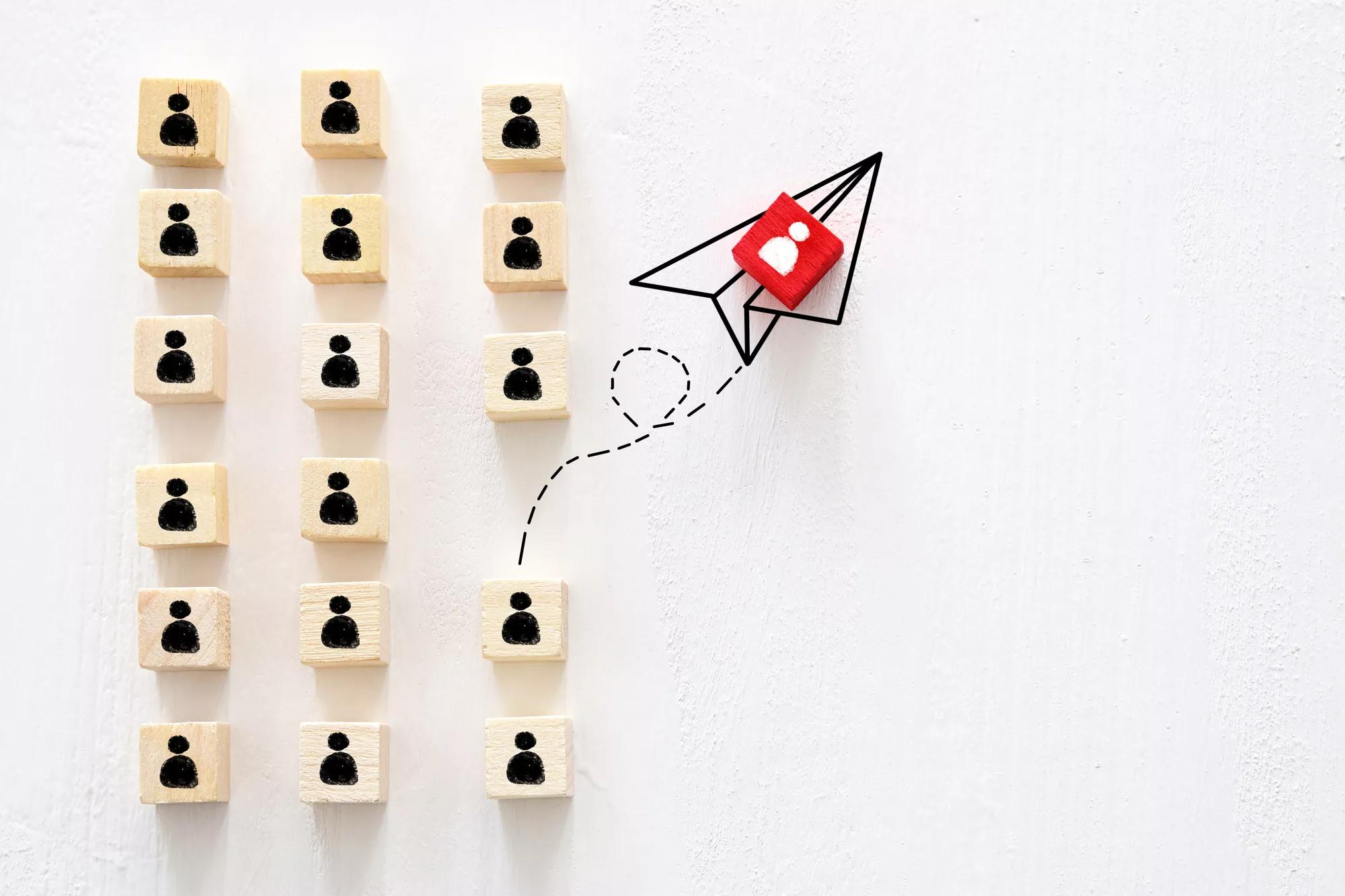 concept of think different, innovation and creativity. red cube changing direction from others.