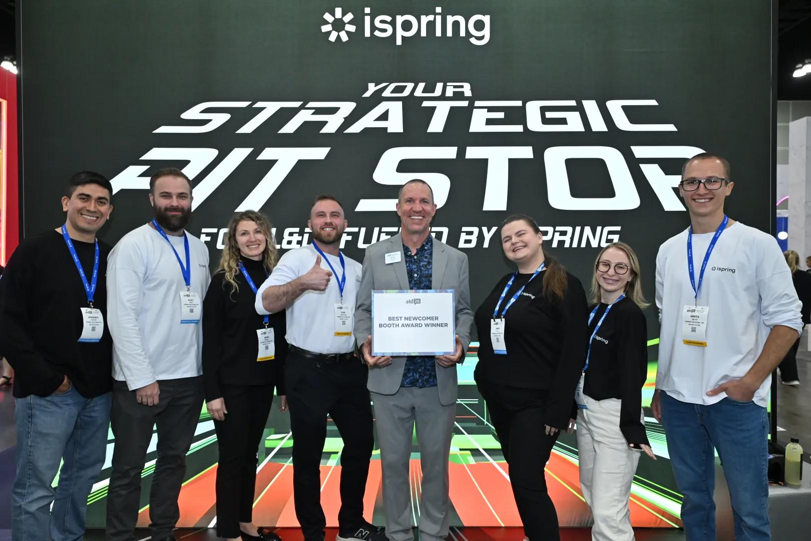 A photo shows the winners of the ATD26 Booth Awards standing in front of their EXPO booths.