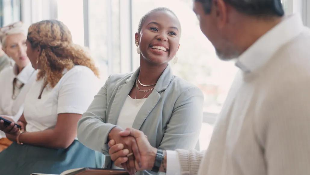 A photo of a two people shaking hands