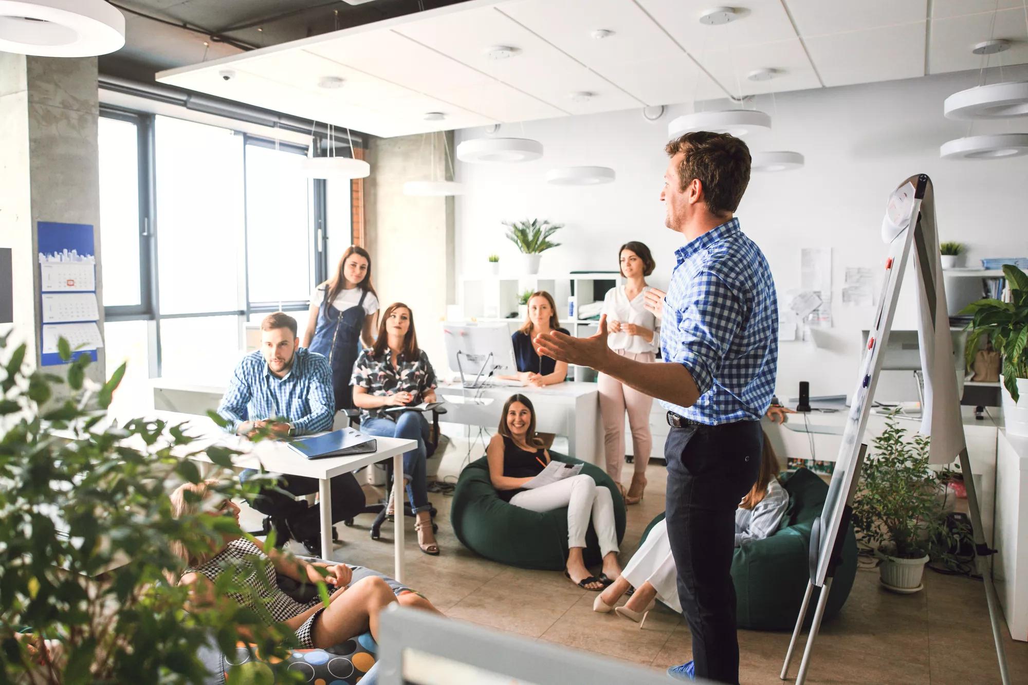 Creative business team technology and office concept boss talking to business team