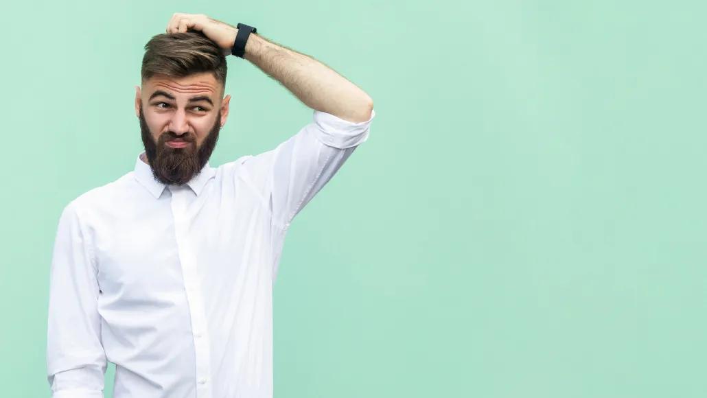 A photo shows a young worker scratching his head, expressing confusion.