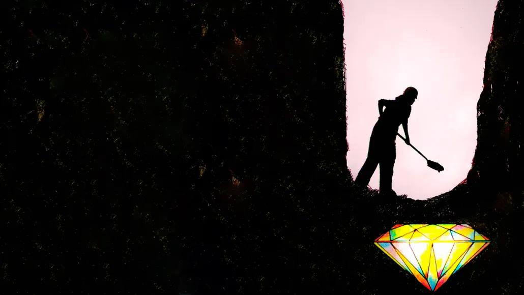 An illustration of a person in a hard hat digging a deep hole with a shovel. They stand in the hole with a large diamond beneath their feet.