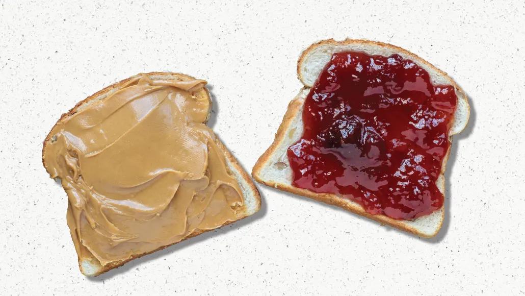 A slice of bread covered in peanut butter and a slice of bread covered in jelly.