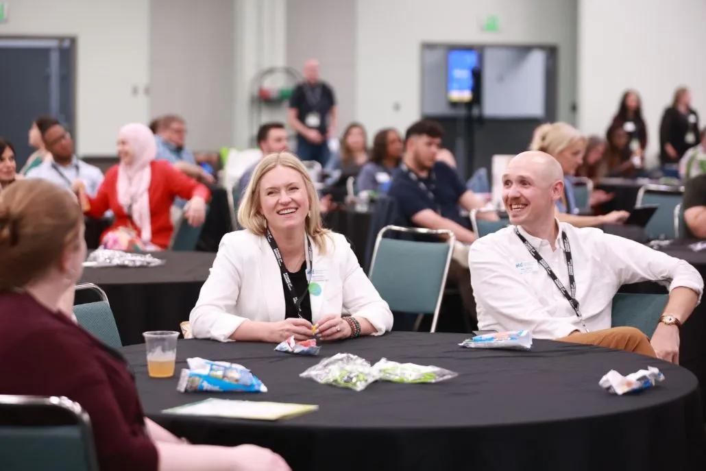 A photo shows attendees of an ALC session seated at a table.