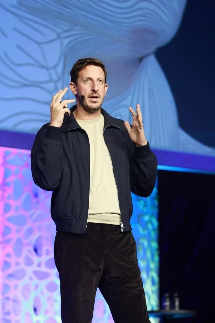A photo shows ATD26 keynote speaker Zack Kass onstage during his presentation.