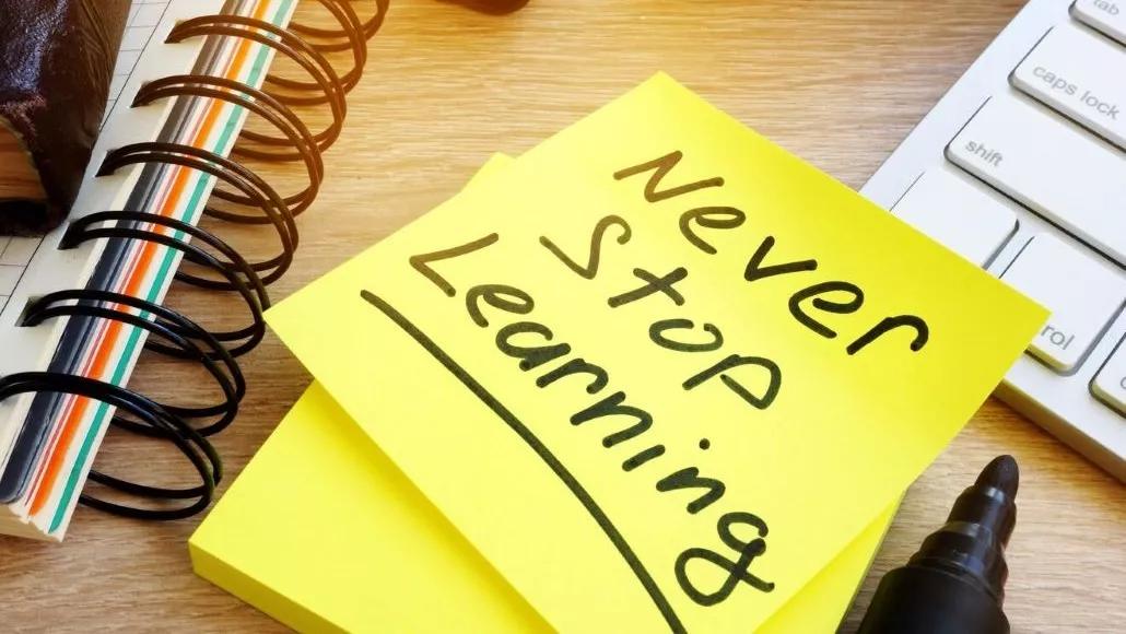 An image of a yellow sticky note with the words never stop learning