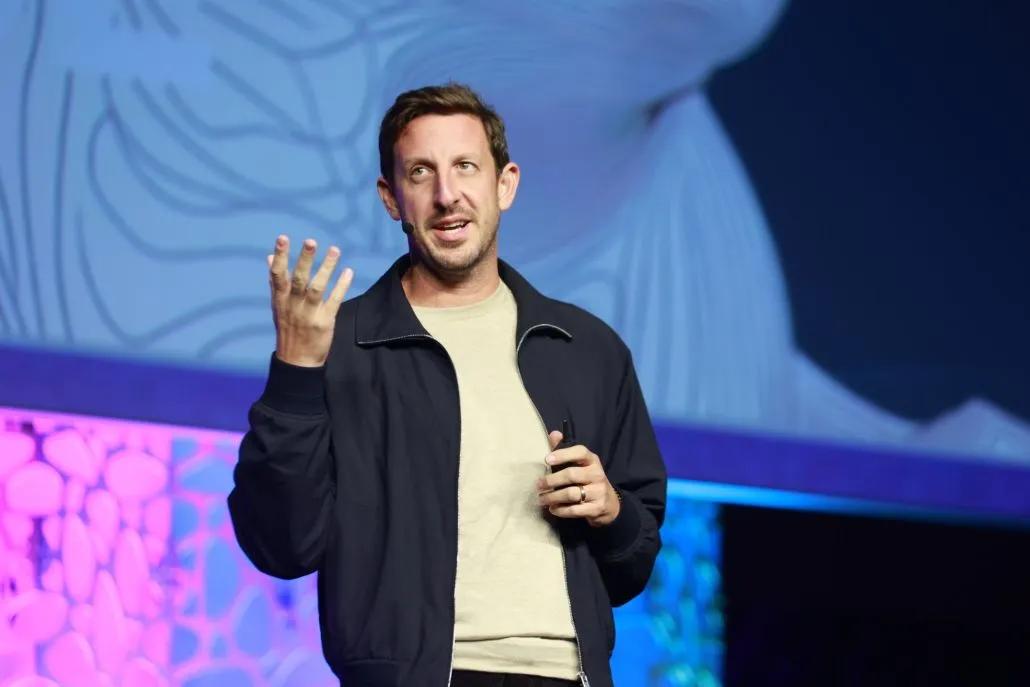 A photo shows ATD26 keynote speaker Zack Kass onstage during his presentation.