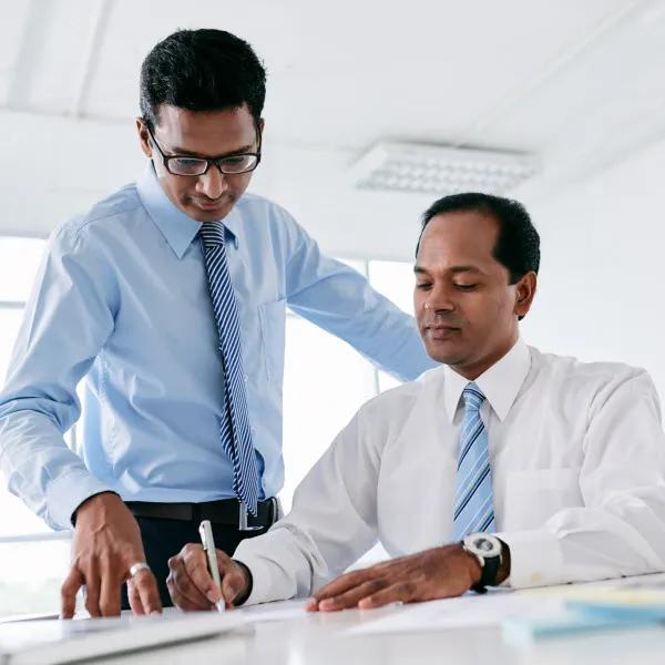 A coach works with their client in the office.