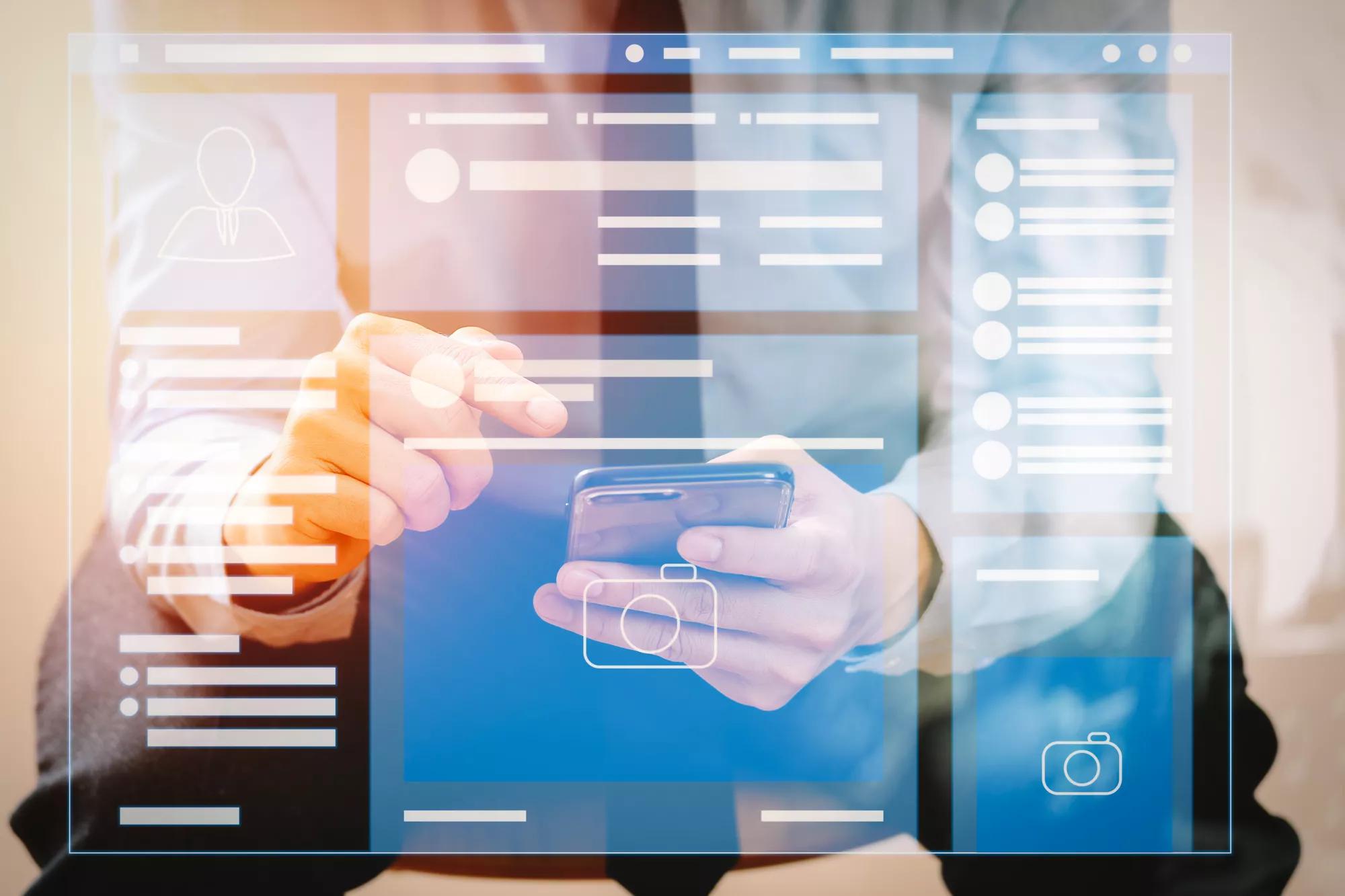 close up of businessman working with mobile phone and sitting on the chair in modern office