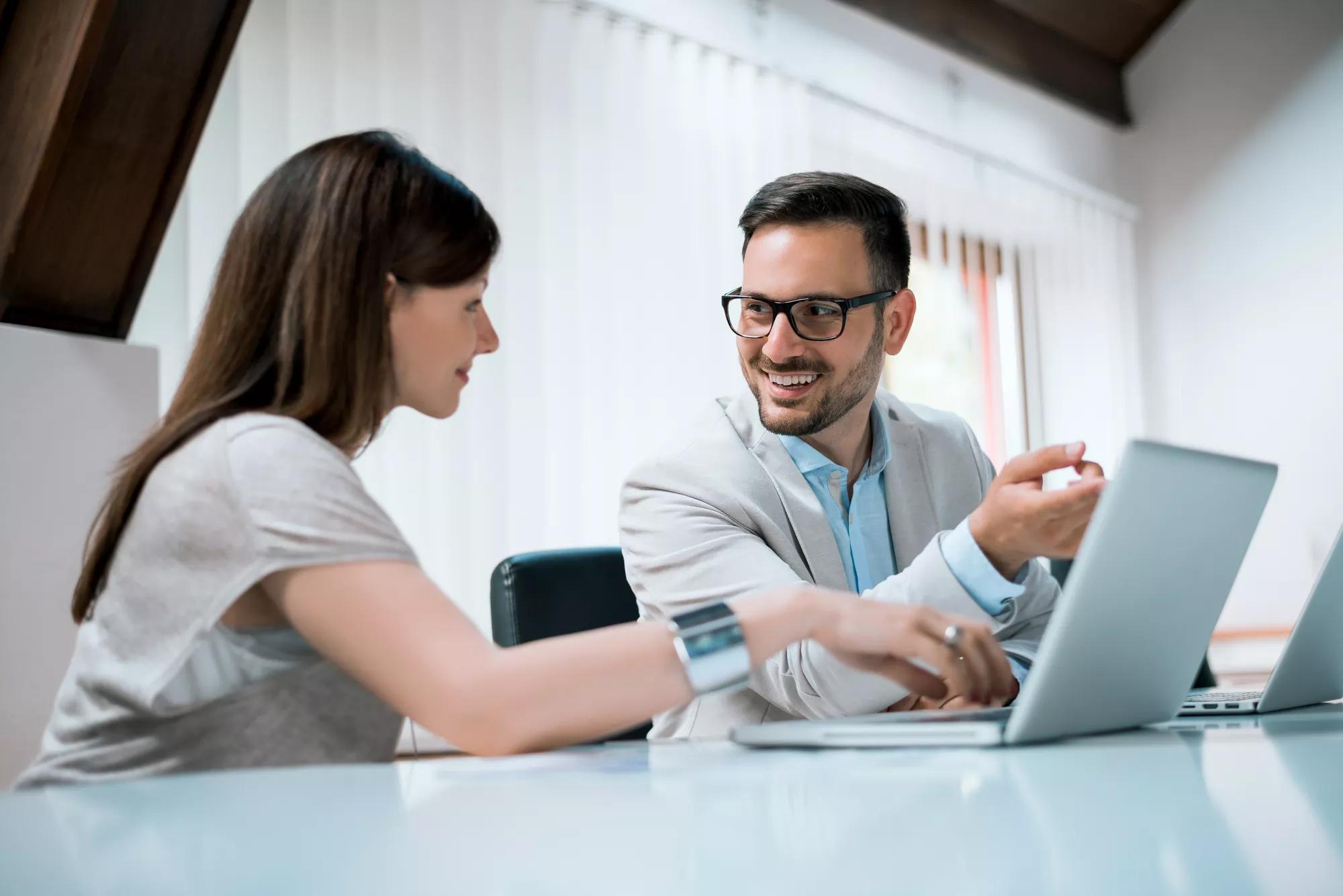 Young businesspeople discuss the new project at office